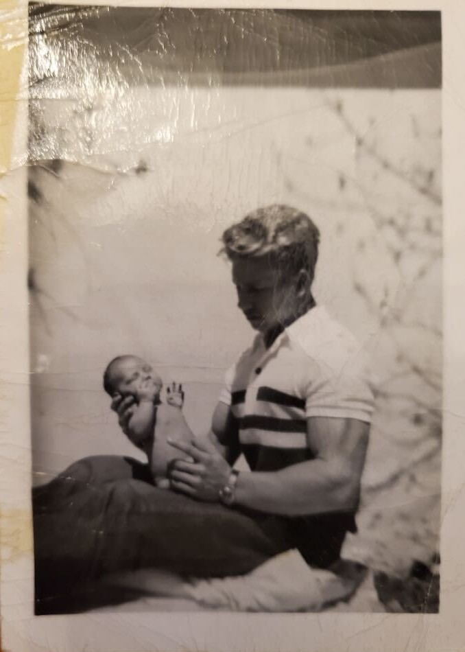Gail Crick holding a newborn baby