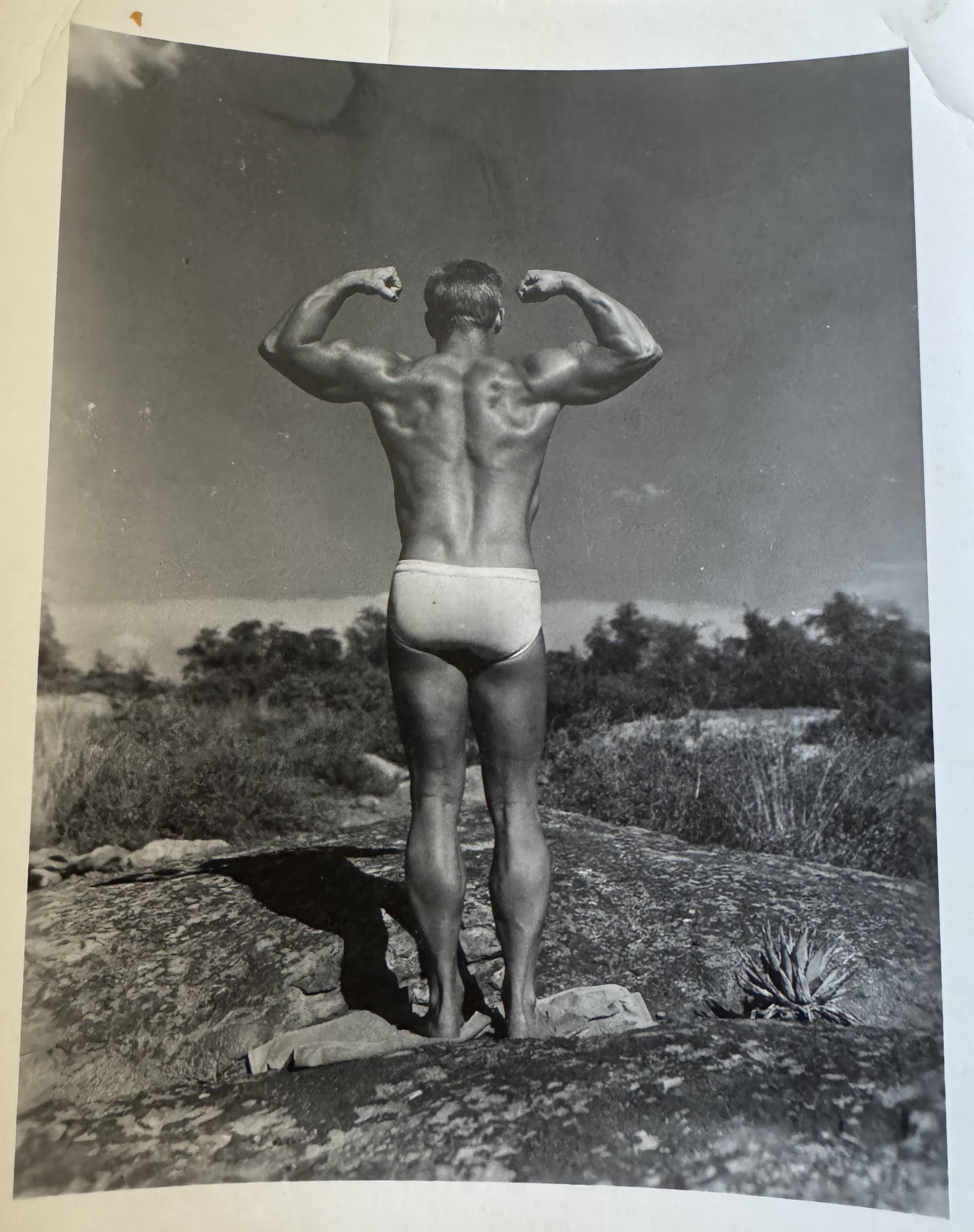 Gail Crick - rear double bicep pose on Arizona rocks