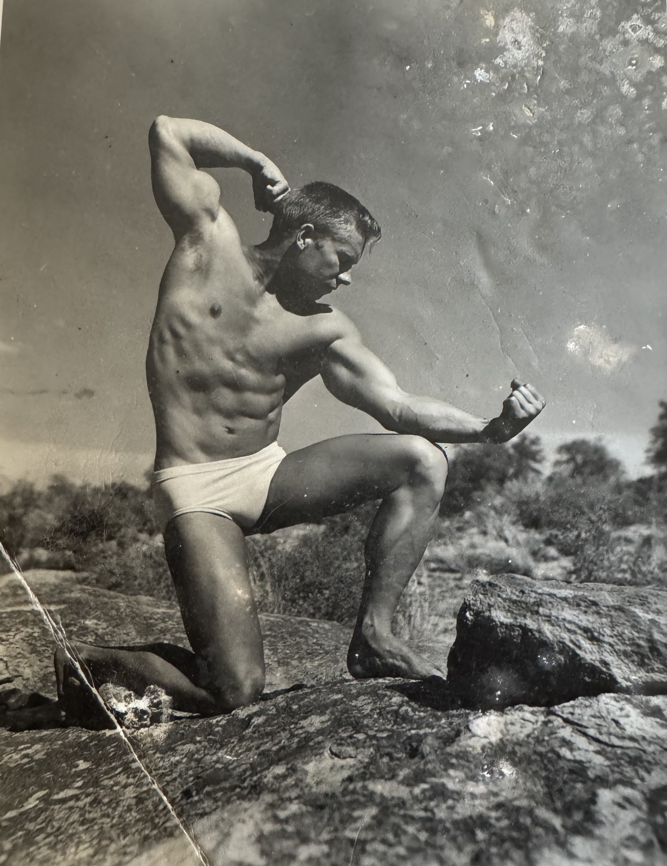 Gail Crick - kneeling pose on Arizona rocks
