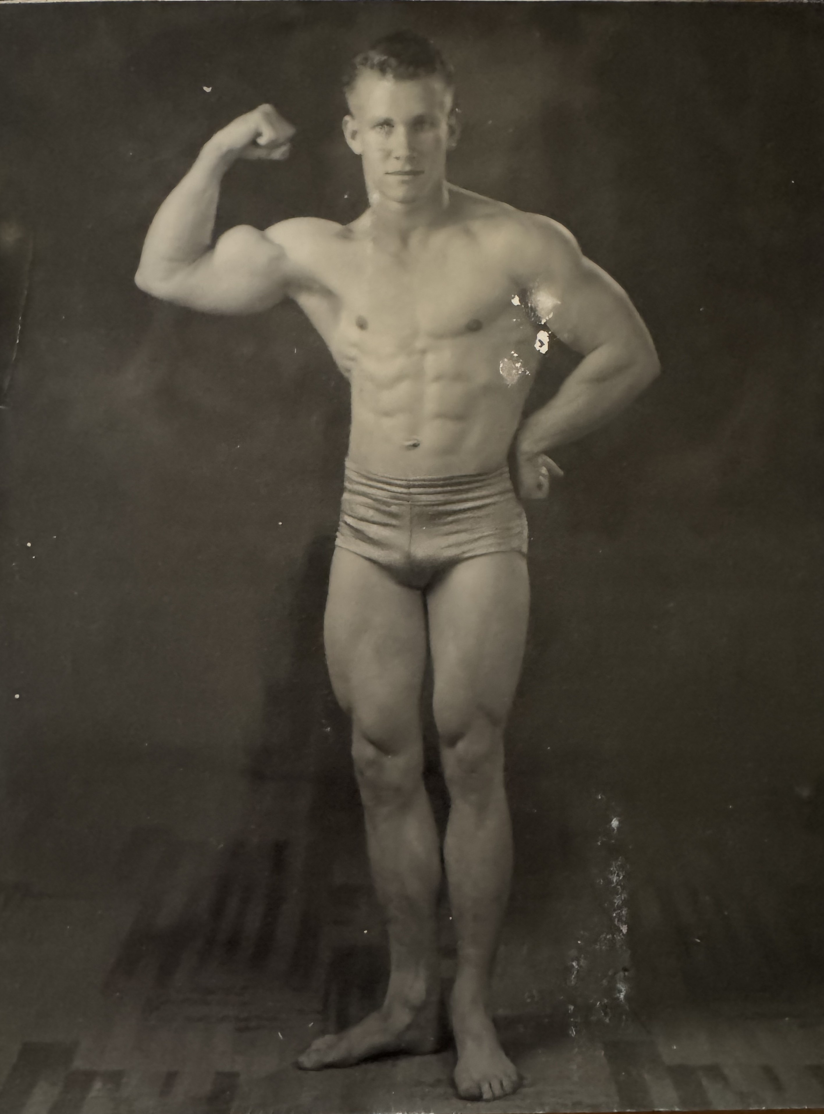 Gail Crick - formal studio portrait, right arm raised